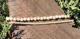 Bracelet with Swarovski Cream Pearls encased with Gold Beads