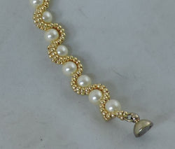 Bracelet with Swarovski Cream Pearls encased with Gold Beads